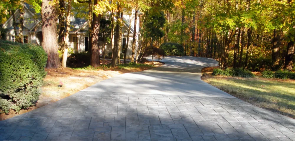 Concrete driveway replacement with stamped concrete apron