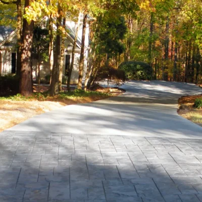 Concrete driveway replacement with stamped concrete apron