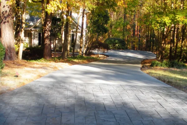 Concrete driveway replacement with stamped concrete apron