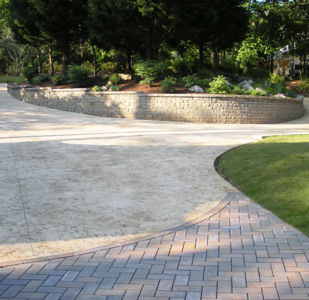 Driveway Replacement showing seamless texture skin pattern for the stamped concrete and pavers used on the apron