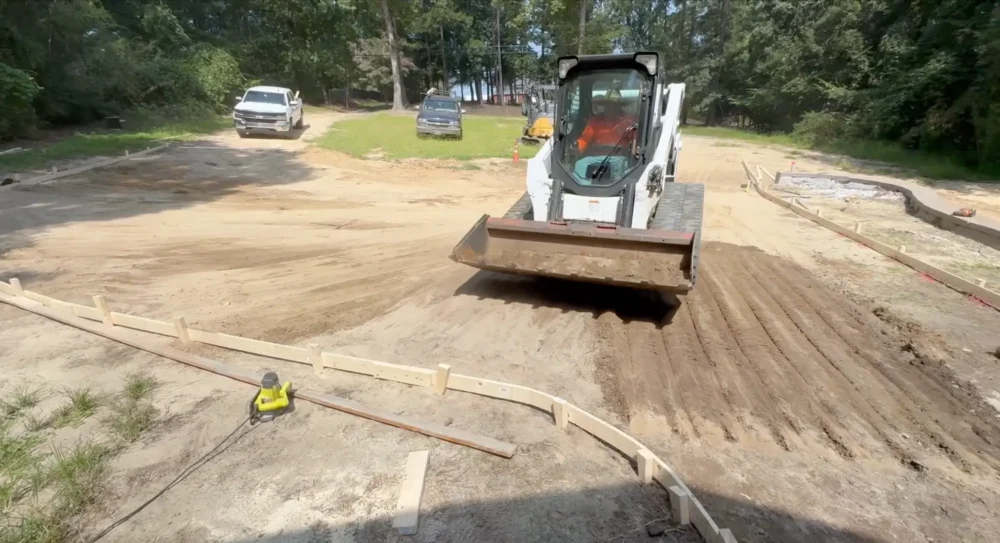 Grading, prepping, and forming for a concrete driveway