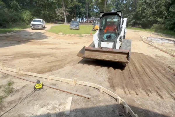 Grading, prepping, and forming for a concrete driveway