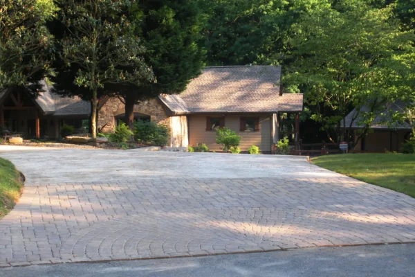 Stamped concrete driveway with pavers at the apron